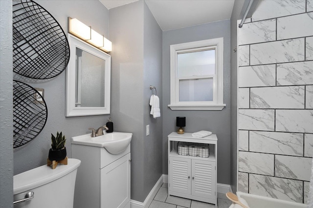bathroom with walk in shower, vanity, baseboards, tile patterned floors, and toilet