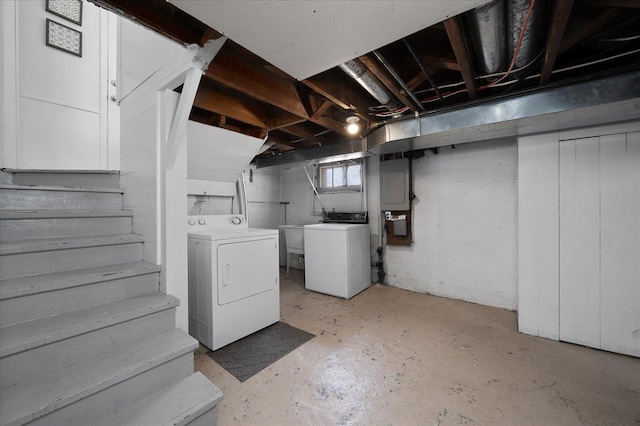 below grade area with separate washer and dryer and stairway
