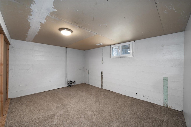 basement featuring carpet and visible vents