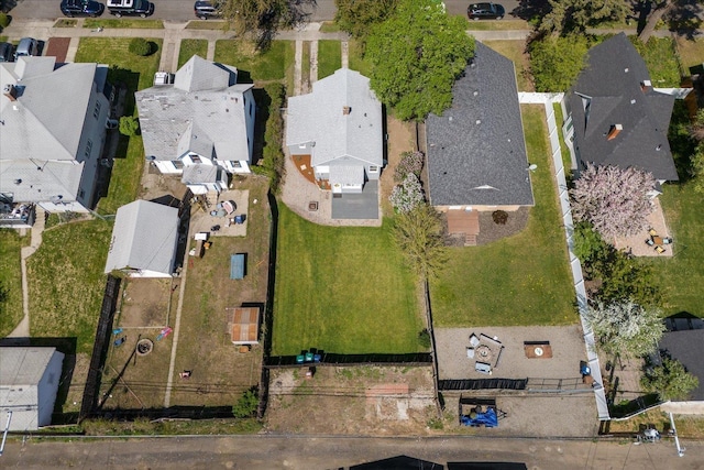 birds eye view of property with a residential view