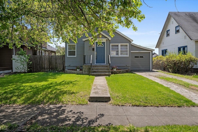 bungalow-style house with fence, dirt driveway, a front lawn, and a garage