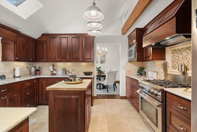 kitchen featuring wood counters, backsplash, premium range hood, and stainless steel appliances