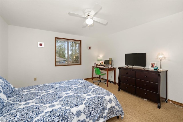 carpeted bedroom featuring baseboards and ceiling fan