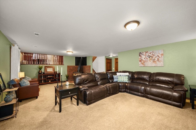 carpeted living room featuring a wood stove
