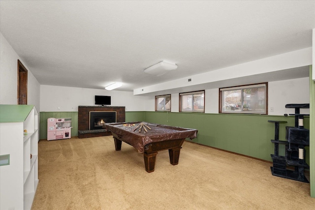 playroom featuring a brick fireplace, light carpet, and billiards