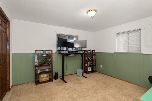 home office featuring carpet floors and wainscoting