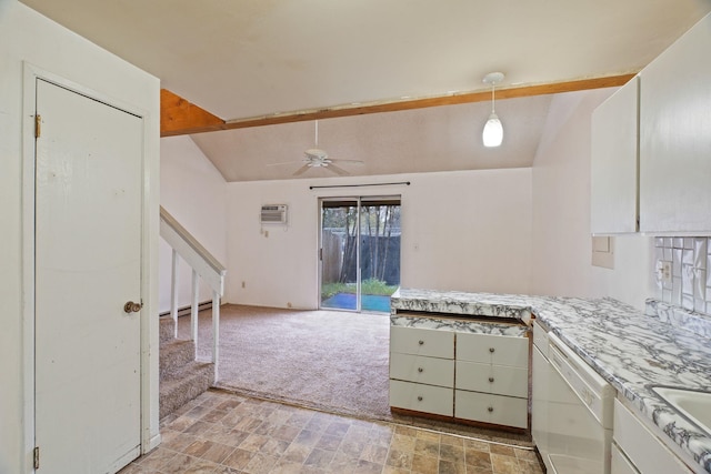 kitchen with an AC wall unit, light countertops, a ceiling fan, white dishwasher, and vaulted ceiling with beams