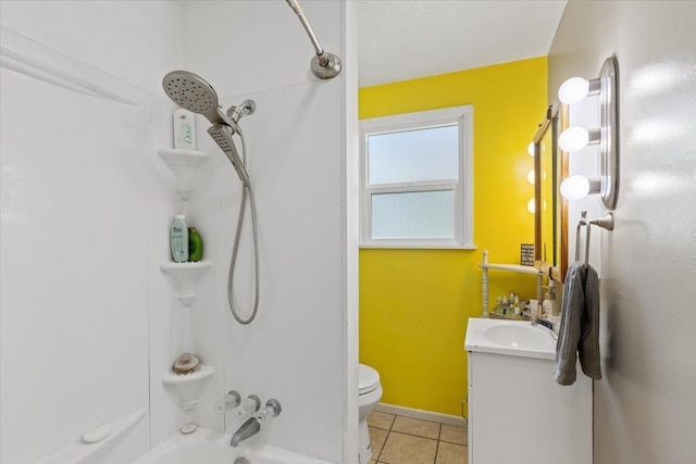 bathroom with tile patterned flooring, washtub / shower combination, toilet, and vanity