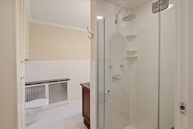 full bath featuring crown molding, radiator, toilet, tile walls, and a stall shower