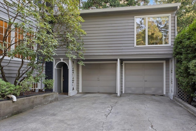 view of front of home featuring a garage and concrete driveway