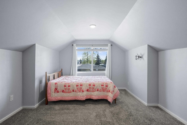 bedroom featuring baseboards, carpet, and vaulted ceiling