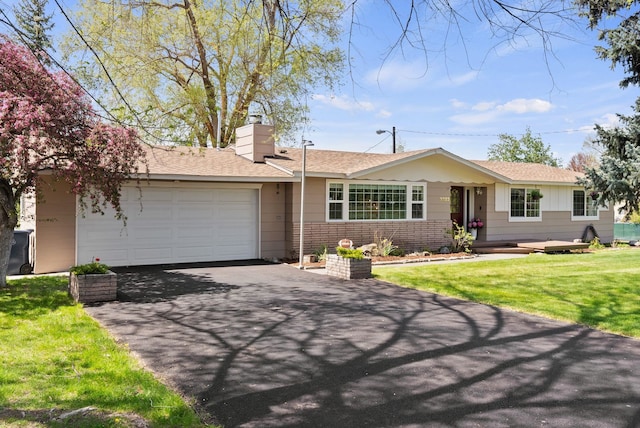 ranch-style home with an attached garage, a chimney, roof with shingles, and aphalt driveway