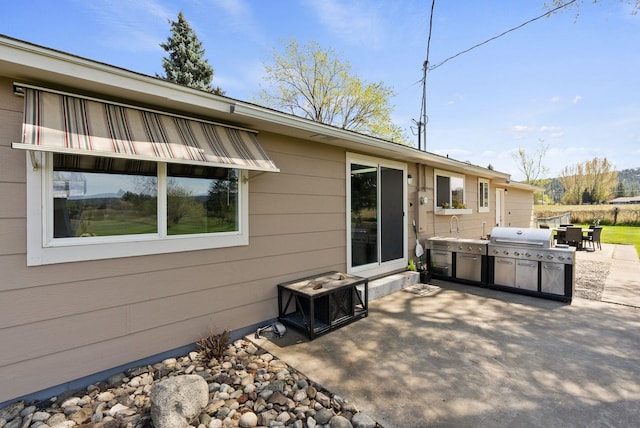 rear view of property featuring a patio