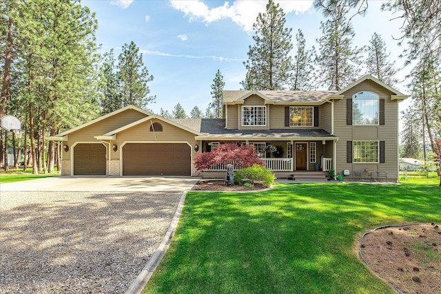 16503 N Mockingbird Ln, Nine Mile Falls, WA 99026 - traditional-style home with roof with shingles, an attached garage, a front yard, concrete driveway, and covered porch