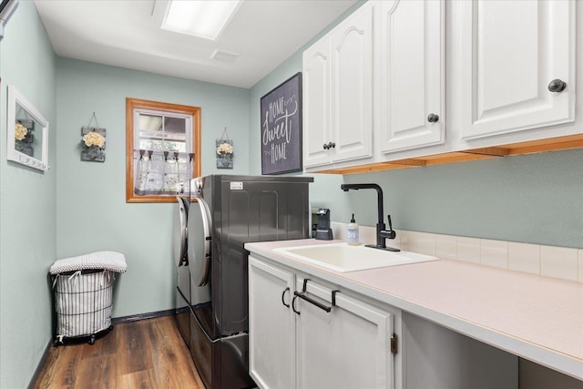 16503 N Mockingbird Ln, Nine Mile Falls, WA 99026 - laundry room with cabinet space, a sink, separate washer and dryer, baseboards, and dark wood-type flooring