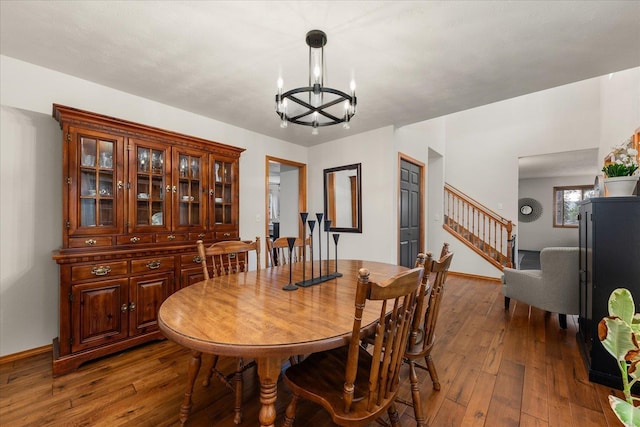 16503 N Mockingbird Ln, Nine Mile Falls, WA 99026 - dining area featuring an inviting chandelier, baseboards, stairway, and hardwood / wood-style floors