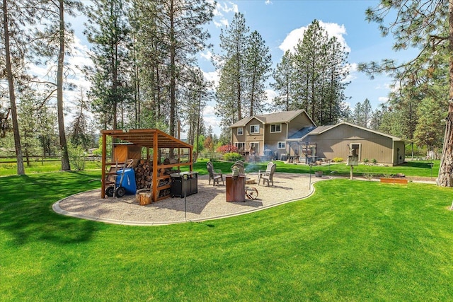 16503 N Mockingbird Ln, Nine Mile Falls, WA 99026 - view of play area with a yard and a fire pit