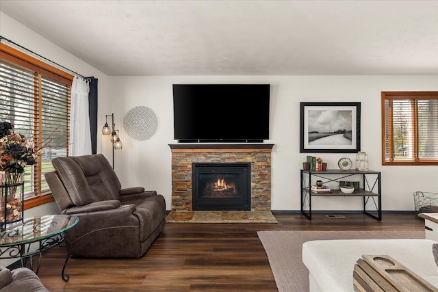16503 N Mockingbird Ln, Nine Mile Falls, WA 99026 - living area featuring baseboards, a fireplace, and dark wood finished floors