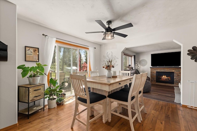 16503 N Mockingbird Ln, Nine Mile Falls, WA 99026 - dining area with wood-type flooring, a ceiling fan, and plenty of natural light