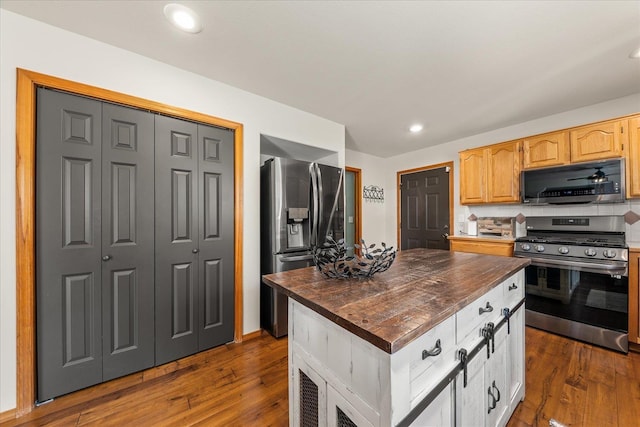 16503 N Mockingbird Ln, Nine Mile Falls, WA 99026 - kitchen with stainless steel appliances, butcher block countertops, recessed lighting, and dark wood-type flooring