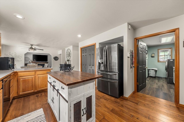 16503 N Mockingbird Ln, Nine Mile Falls, WA 99026 - kitchen with stainless steel fridge, ceiling fan, wooden counters, and dark wood-style flooring