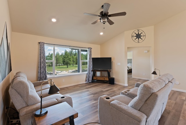 living room featuring wood finished floors, baseboards, recessed lighting, a ceiling fan, and vaulted ceiling