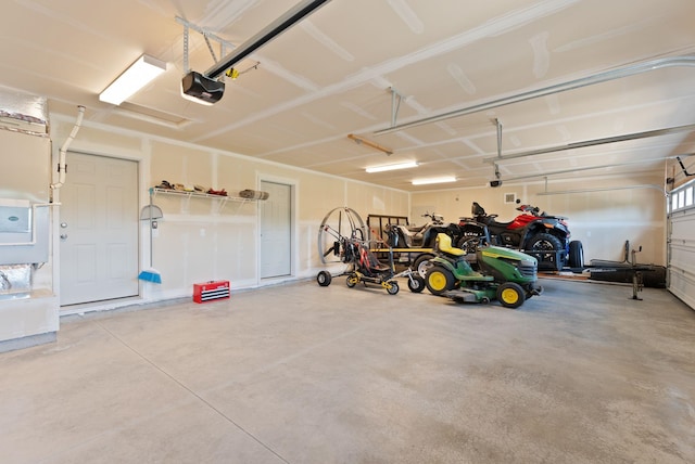 garage featuring a garage door opener