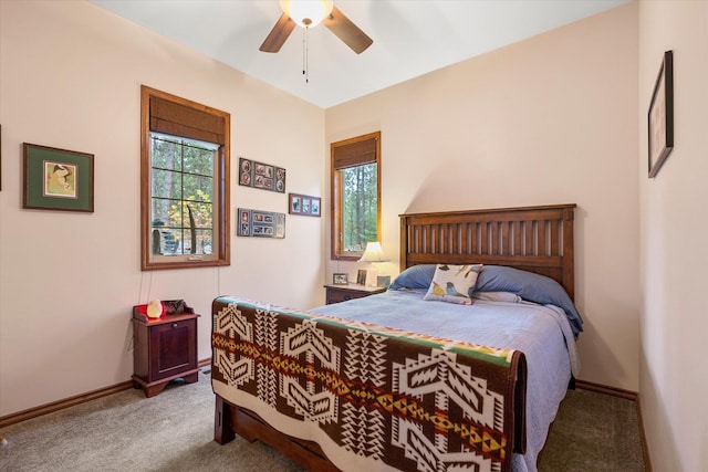 bedroom featuring carpet flooring, baseboards, and ceiling fan