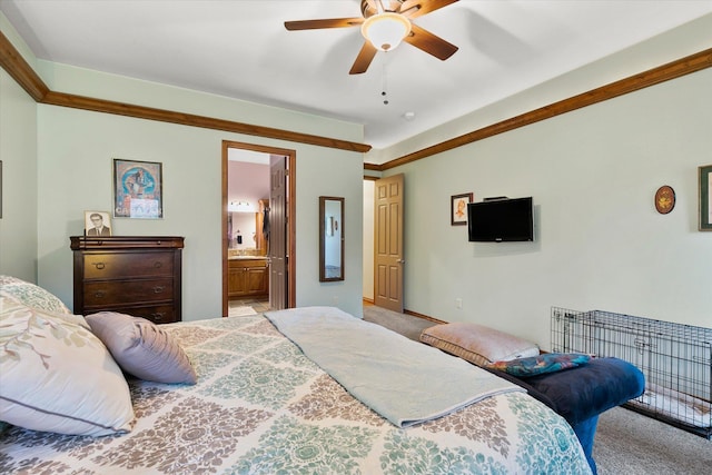 bedroom with carpet floors, a ceiling fan, baseboards, and ensuite bathroom