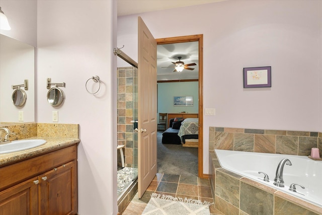 bathroom with ceiling fan, a garden tub, a shower stall, vanity, and connected bathroom