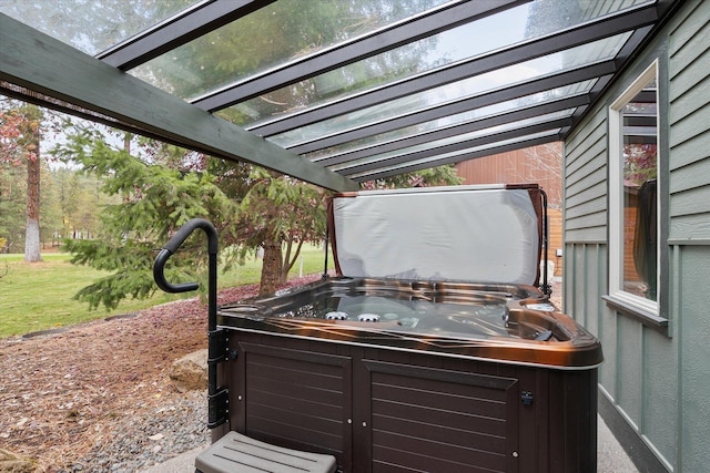 exterior space featuring a pergola and a hot tub
