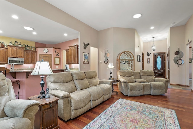 living area featuring recessed lighting and dark wood-style floors