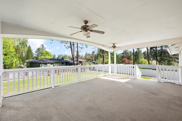 view of patio featuring ceiling fan and fence