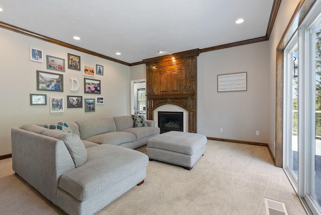 living area featuring crown molding, recessed lighting, light colored carpet, and visible vents