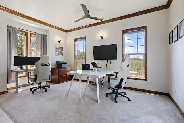 carpeted home office with baseboards, ornamental molding, and a ceiling fan