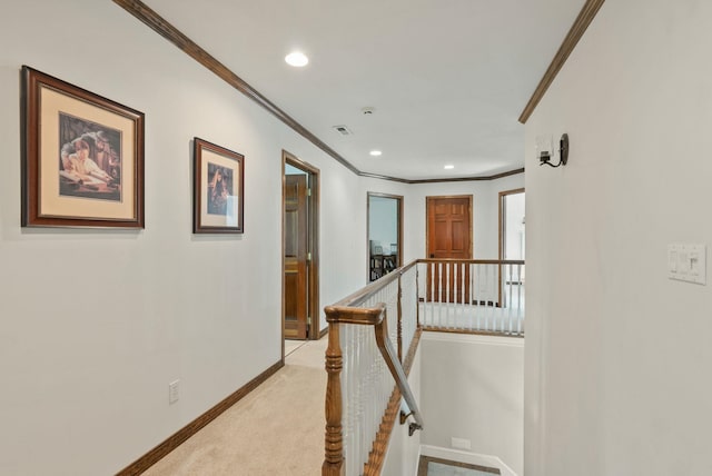 hallway featuring baseboards, an upstairs landing, ornamental molding, and visible vents
