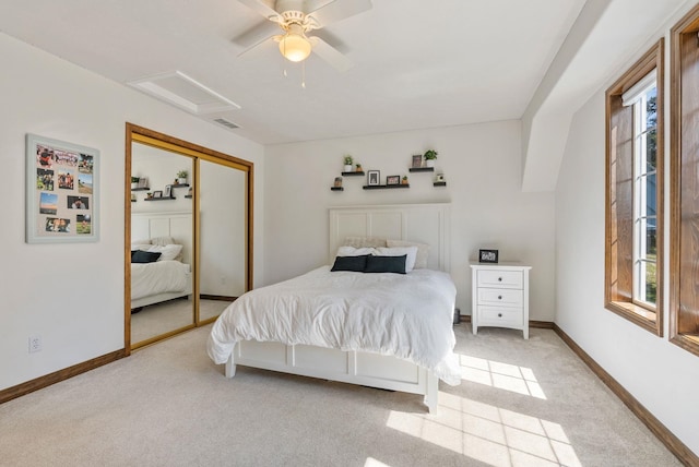 bedroom featuring attic access, visible vents, light colored carpet, baseboards, and a closet