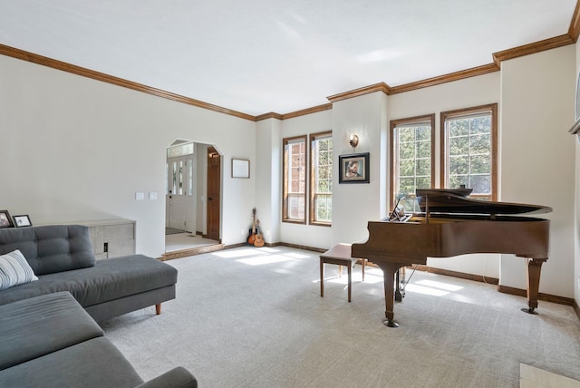 living room with arched walkways, ornamental molding, baseboards, and carpet floors
