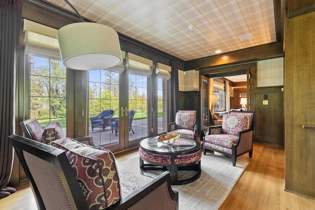 615 E 16th Ave, Spokane, WA 99203 - living area with a wealth of natural light, wooden walls, french doors, and light wood-type flooring