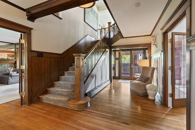 615 E 16th Ave, Spokane, WA 99203 - entryway with crown molding, stairway, and wood finished floors