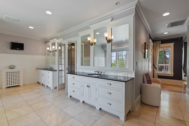 615 E 16th Ave, Spokane, WA 99203 - full bath with crown molding, two vanities, visible vents, and tile patterned floors