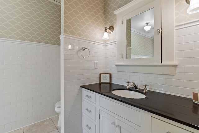 615 E 16th Ave, Spokane, WA 99203 - bathroom featuring tile walls, wallpapered walls, toilet, tile patterned flooring, and vanity