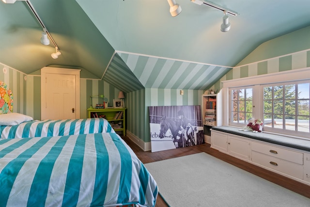 615 E 16th Ave, Spokane, WA 99203 - bedroom with lofted ceiling, baseboards, wallpapered walls, rail lighting, and dark wood finished floors