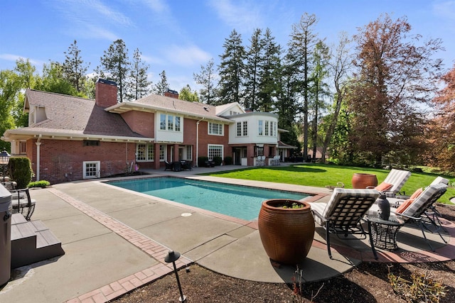 615 E 16th Ave, Spokane, WA 99203 - pool featuring a lawn and a patio