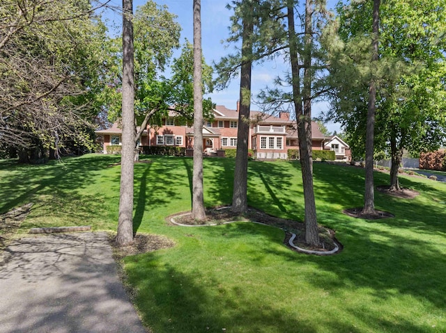 615 E 16th Ave, Spokane, WA 99203 - view of front facade with a front lawn and a chimney