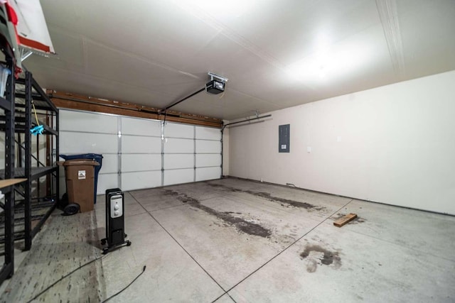 garage featuring a garage door opener and electric panel