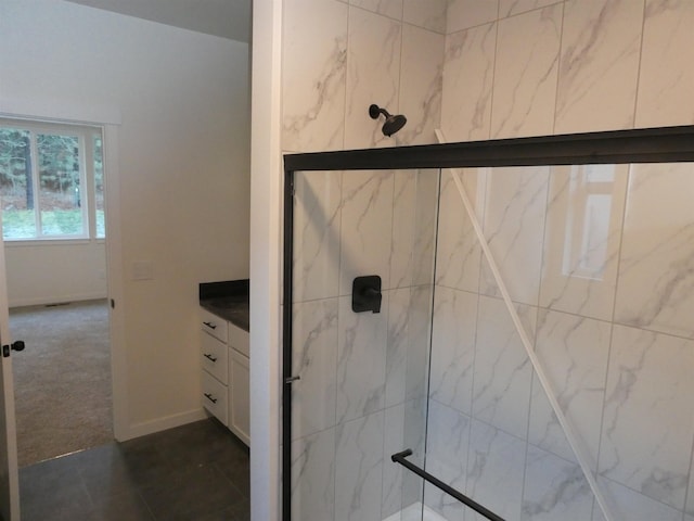 bathroom with a marble finish shower