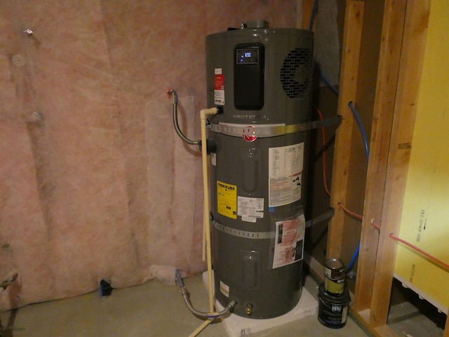utility room featuring water heater