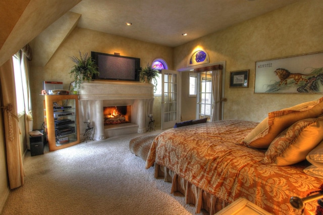 2010 E Pinecrest Rd, Spokane, WA 99203 - bedroom with recessed lighting, carpet, and a lit fireplace