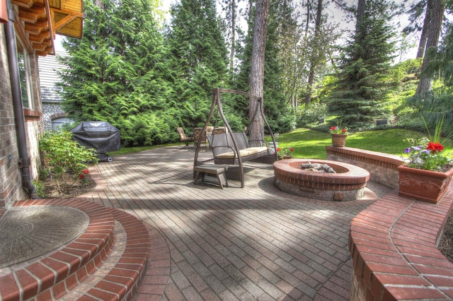 2010 E Pinecrest Rd, Spokane, WA 99203 - deck with area for grilling and an outdoor fire pit
